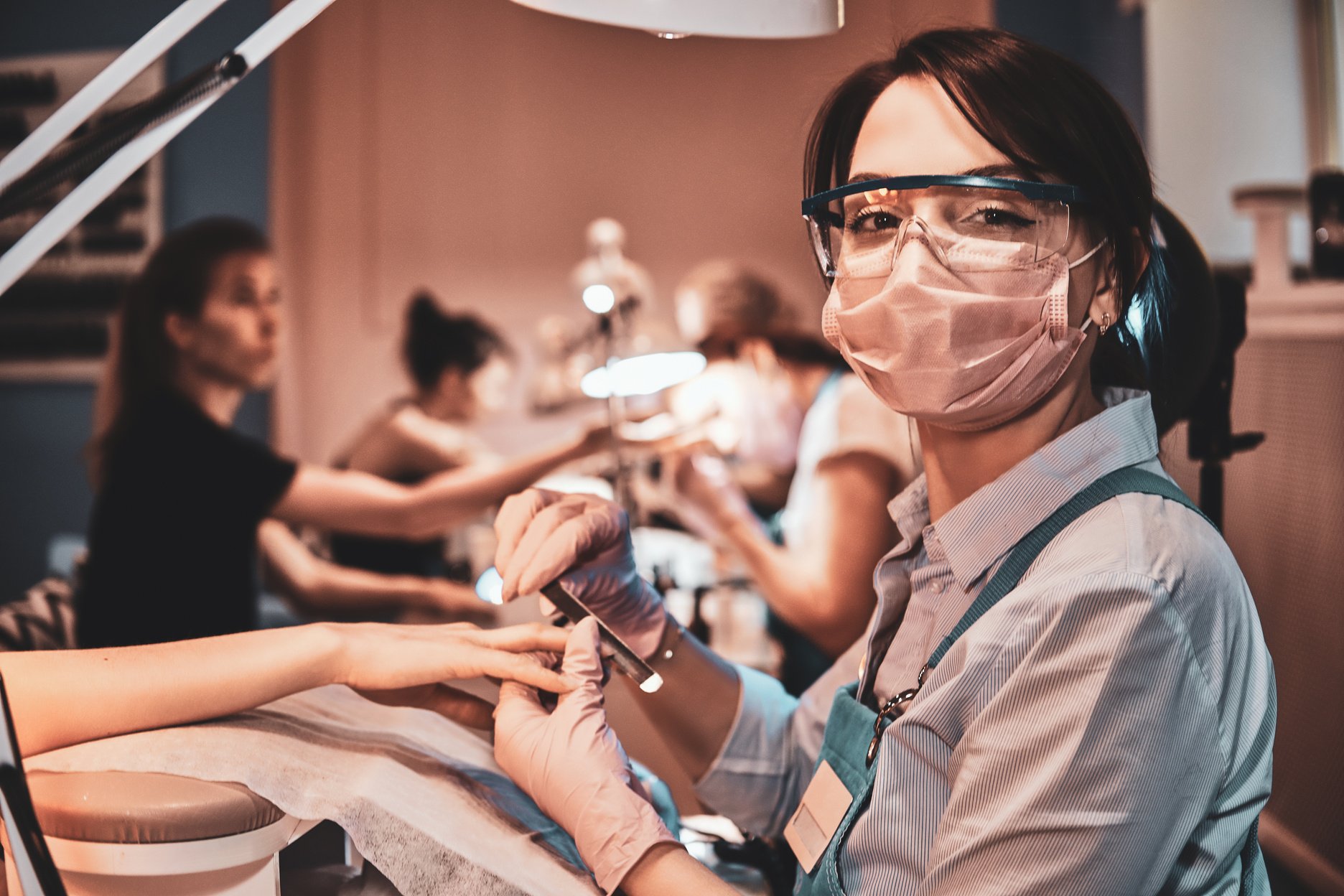 Nail Treatment Process at Busy Manicure Salon.